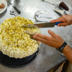 Cutting pistachio cake