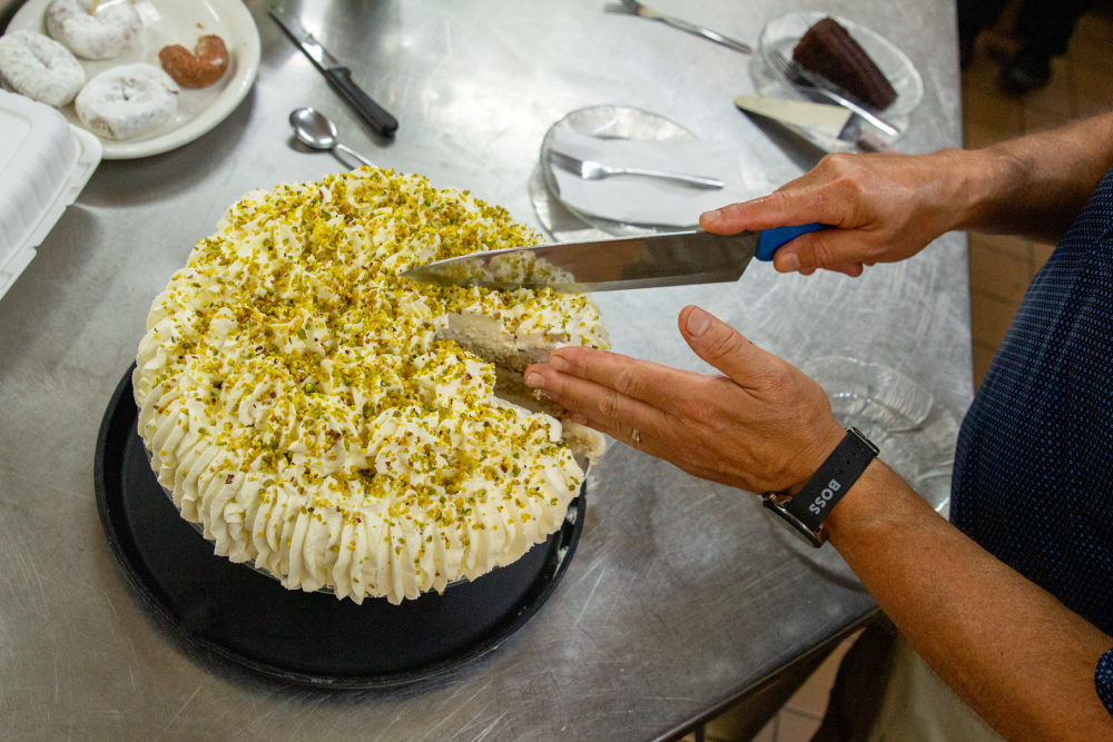 Cutting pistachio cake